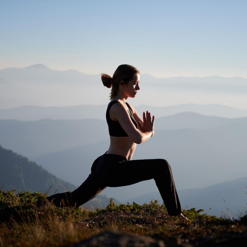 sporty-young-woman-practicing-yoga-mountains diet and exercise routines